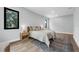 Cozy bedroom with hardwood floors, natural light, and stylish furnishings at 2300 S Brown Ave, Orlando, FL 32806
