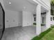The home's covered patio is perfect for outdoor entertaining and relaxing, with views of the backyard at 2300 S Brown Ave, Orlando, FL 32806