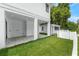 Spacious covered patio and garage area with manicured green lawn at 2300 S Brown Ave, Orlando, FL 32806