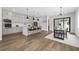 Modern kitchen with stainless steel appliances, a central island with barstool seating, and adjacent dining area at 2300 S Brown Ave, Orlando, FL 32806