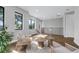 Spacious living area with hardwood floors, abundant natural light, and stylish furniture at 2300 S Brown Ave, Orlando, FL 32806