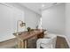 Bright home office with a wooden desk, modern lamp, and a comfortable chair at 2300 S Brown Ave, Orlando, FL 32806