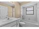 Bright bathroom with sink, toilet, tub and shower combo, and large mirror at 2351 El Prado Ter, Deltona, FL 32725