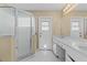 Primary bathroom features glass-enclosed shower, marble counter, and single sink vanity at 2351 El Prado Ter, Deltona, FL 32725