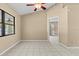 Bedroom featuring a ceiling fan, large window, and neutral paint at 2351 El Prado Ter, Deltona, FL 32725