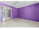 Bedroom with tile floor, ceiling fan, and closet with mirrored sliding doors at 2351 El Prado Ter, Deltona, FL 32725