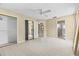 Bright bedroom featuring tile floors, ceiling fan, and closet at 2351 El Prado Ter, Deltona, FL 32725