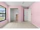 Bedroom with tile flooring, closet, and natural light from a window at 2351 El Prado Ter, Deltona, FL 32725
