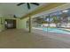 Covered patio with ceiling fan and view of the pool, perfect for outdoor relaxation and entertaining at 2351 El Prado Ter, Deltona, FL 32725