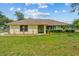Charming one-story home featuring a well-manicured lawn and a welcoming front porch at 2351 El Prado Ter, Deltona, FL 32725