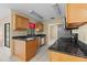 Well-lit kitchen featuring dark countertops and stainless steel appliances at 2351 El Prado Ter, Deltona, FL 32725