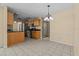 Eat-in kitchen features tile floors, wood cabinets, and stainless steel appliances at 2351 El Prado Ter, Deltona, FL 32725