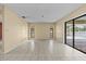Spacious room with tile floor has sliding glass doors that lead to the pool at 2351 El Prado Ter, Deltona, FL 32725