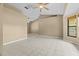 Spacious living room featuring tile floors, ceiling fans, and neutral paint at 2351 El Prado Ter, Deltona, FL 32725