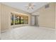 Bright and airy living room featuring tile floors and a large bay window at 2351 El Prado Ter, Deltona, FL 32725