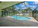 Inviting pool with a screened enclosure, perfect for enjoying a swim in any weather at 2351 El Prado Ter, Deltona, FL 32725