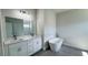 Elegant bathroom featuring double vanity with stone countertop and a freestanding soaking tub at 2500 Sw 156Th Ln Rd, Ocala, FL 34473