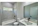 Well-lit bathroom with marble-tiled shower, modern vanity, and sleek fixtures create a serene atmosphere at 2500 Sw 156Th Ln Rd, Ocala, FL 34473