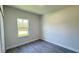 Cozy bedroom with light gray walls and a window with lots of natural light at 2500 Sw 156Th Ln Rd, Ocala, FL 34473