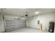 Spacious garage with roll up door, water heater and other mechanicals at 2500 Sw 156Th Ln Rd, Ocala, FL 34473