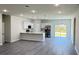 Spacious open floorplan with modern kitchen and living space with bright, neutral tones at 2500 Sw 156Th Ln Rd, Ocala, FL 34473