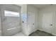 Modern bathroom featuring a luxurious shower with marble-style tiling and a window at 2500 Sw 156Th Ln Rd, Ocala, FL 34473