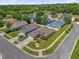 Neighborhood street featuring single-Gathering homes with large lawns, mature trees, and neighborhood lake at 2513 Hickory Oak Blvd, Orlando, FL 32817
