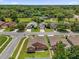 Aerial shot showing single-Gathering home and neighborhood with mature trees and forest at 2513 Hickory Oak Blvd, Orlando, FL 32817