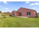 Backyard with grass, patio, and view of the home's rear exterior in daylight at 2513 Hickory Oak Blvd, Orlando, FL 32817
