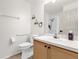 Neutral bathroom with wood cabinets, toilet, and shower with wall-mounted handheld head at 2513 Hickory Oak Blvd, Orlando, FL 32817