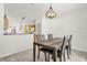 Open-concept dining area with a stylish chandelier and easy access to the kitchen at 2513 Hickory Oak Blvd, Orlando, FL 32817