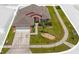 Well-maintained single-story home with a manicured lawn, tidy landscaping, and an attached two-car garage at 2513 Hickory Oak Blvd, Orlando, FL 32817