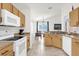 Well-equipped kitchen with breakfast bar, wood cabinets and ample countertop space at 2513 Hickory Oak Blvd, Orlando, FL 32817