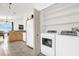 Adjacent to kitchen: laundry room with shelving at 2513 Hickory Oak Blvd, Orlando, FL 32817