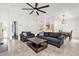 Spacious living room with high ceilings, ceiling fan, tile flooring, and comfortable seating at 2513 Hickory Oak Blvd, Orlando, FL 32817
