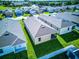 Aerial view showcasing the home's backyard and surrounding neighborhood at 2932 Whispering Trails Dr, Winter Haven, FL 33884
