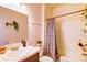 Bathroom featuring a tub with shower, and neutral colored shower curtain at 2932 Whispering Trails Dr, Winter Haven, FL 33884