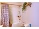 Bathroom featuring a tub with shower, and neutral colored shower curtain at 2932 Whispering Trails Dr, Winter Haven, FL 33884