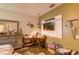 Cozy bedroom featuring a desk, TV, neutral paint, and stylish decorations at 2932 Whispering Trails Dr, Winter Haven, FL 33884