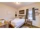 Comfortable bedroom with a large bed, wooden dresser, and decorative wall art at 2932 Whispering Trails Dr, Winter Haven, FL 33884