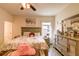 Bright bedroom featuring a stylish dresser and a bed with elegant linens at 2932 Whispering Trails Dr, Winter Haven, FL 33884