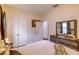 Bright bedroom with closet, dresser, and doorway to other rooms at 2932 Whispering Trails Dr, Winter Haven, FL 33884