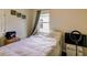 Modest bedroom with a bed, large window, and a view to the outside at 2932 Whispering Trails Dr, Winter Haven, FL 33884