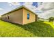 Angle view of a home's exterior featuring a window and screened-in patio at 2932 Whispering Trails Dr, Winter Haven, FL 33884