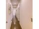 Long hallway featuring polished concrete floors and white walls with recessed lighting at 2932 Whispering Trails Dr, Winter Haven, FL 33884