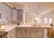 Bright kitchen featuring gray cabinets, white countertops, stainless steel appliances, and pendant lighting at 2932 Whispering Trails Dr, Winter Haven, FL 33884