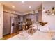 Modern kitchen with stainless steel appliances, stylish backsplash, and ample counter space at 2932 Whispering Trails Dr, Winter Haven, FL 33884