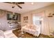 The living room is bathed in natural light, featuring an accent wall with an electric fireplace at 2932 Whispering Trails Dr, Winter Haven, FL 33884
