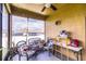 Enclosed patio with wicker furniture, ceiling fan, and view of the backyard at 2932 Whispering Trails Dr, Winter Haven, FL 33884