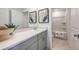Bathroom with a single sink vanity and a shower-tub combo at 325 Cornerstone Dr, Groveland, FL 34736
